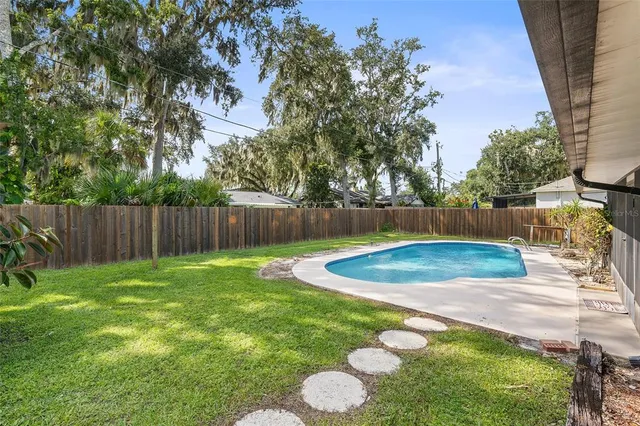 a view of a house with a ceiling fan and a large window