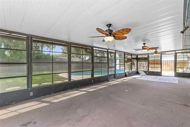 a very nice looking room with a large window and chandelier
