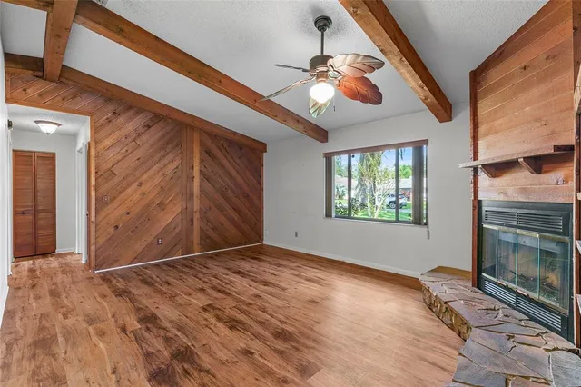 a view of walk in closet with clothes