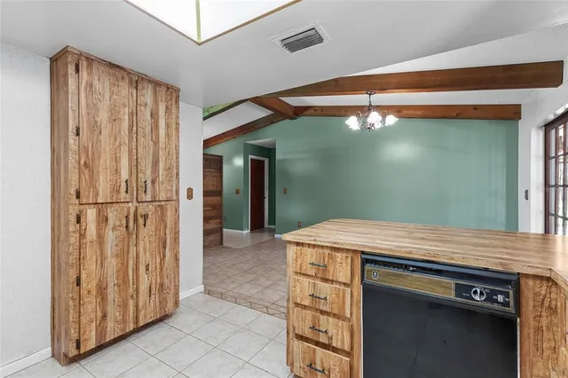 a view of a livingroom with a ceiling fan and a window