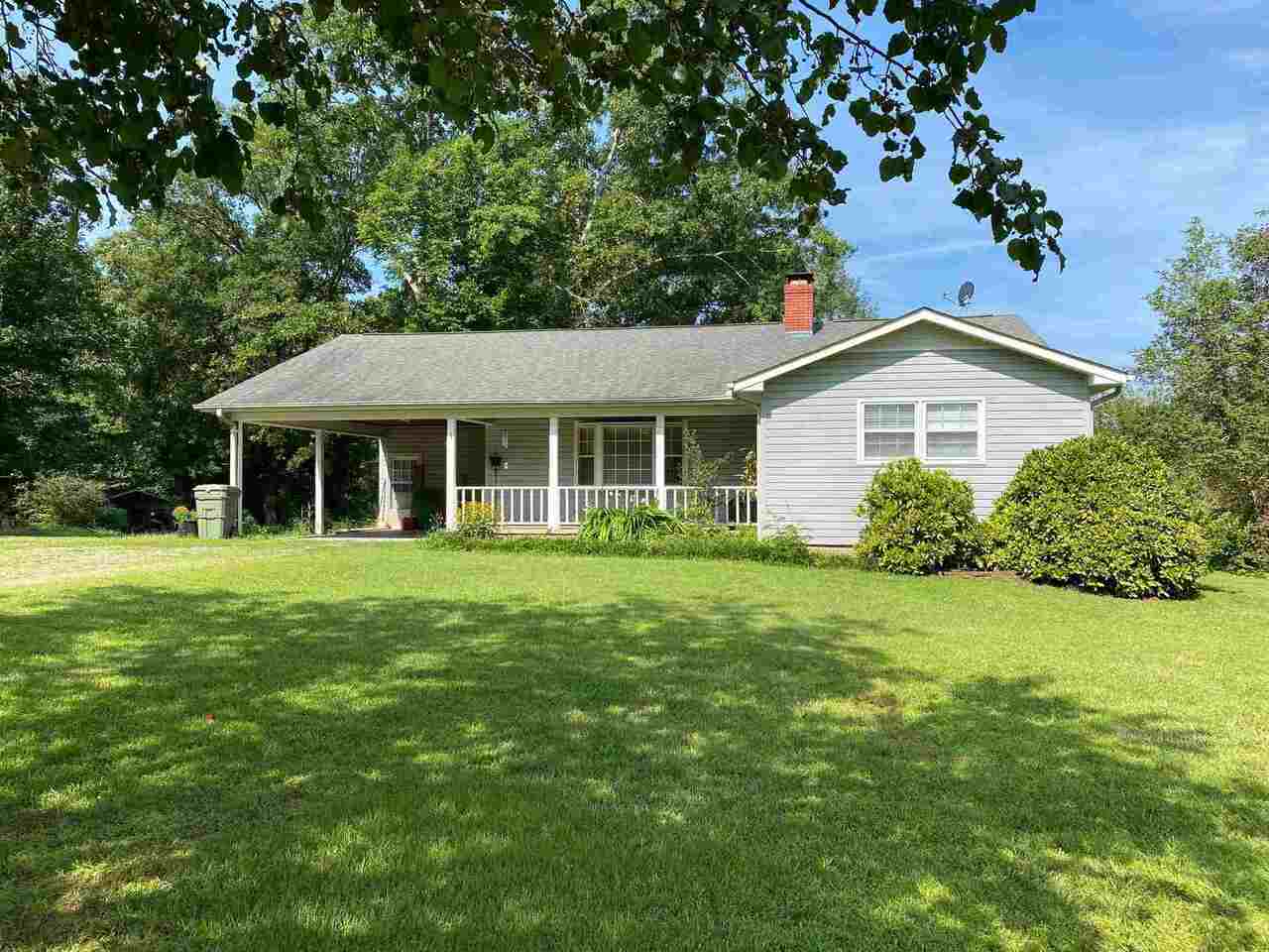518 Lothridge Road Cleveland, GA 30528 - Photo 1 of 1 a front view of a house with a garden