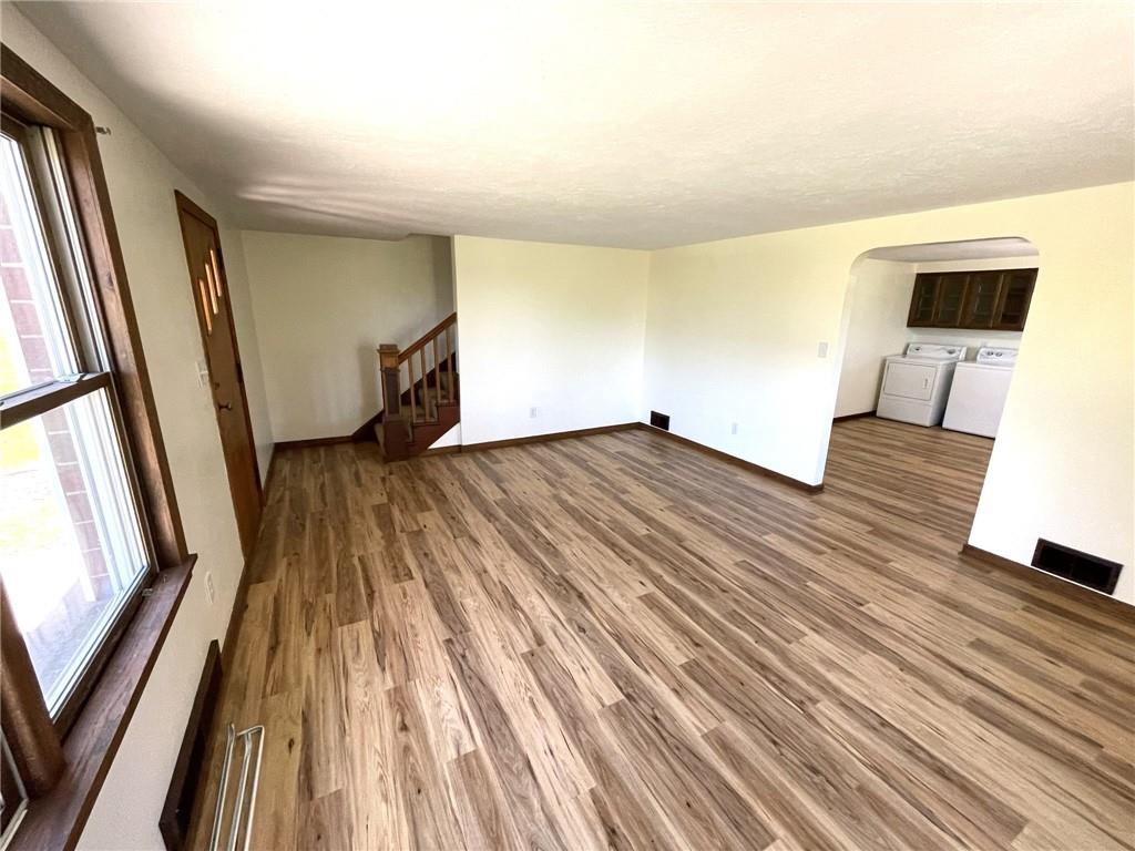 436 East Slippery Rock Road Chicora, PA 16025 - Photo 11 of 40 a view of an empty room with wooden floor and a window