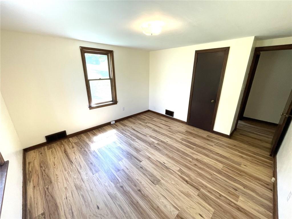 436 East Slippery Rock Road Chicora, PA 16025 - Photo 14 of 40 a view of an empty room with wooden floor and a window