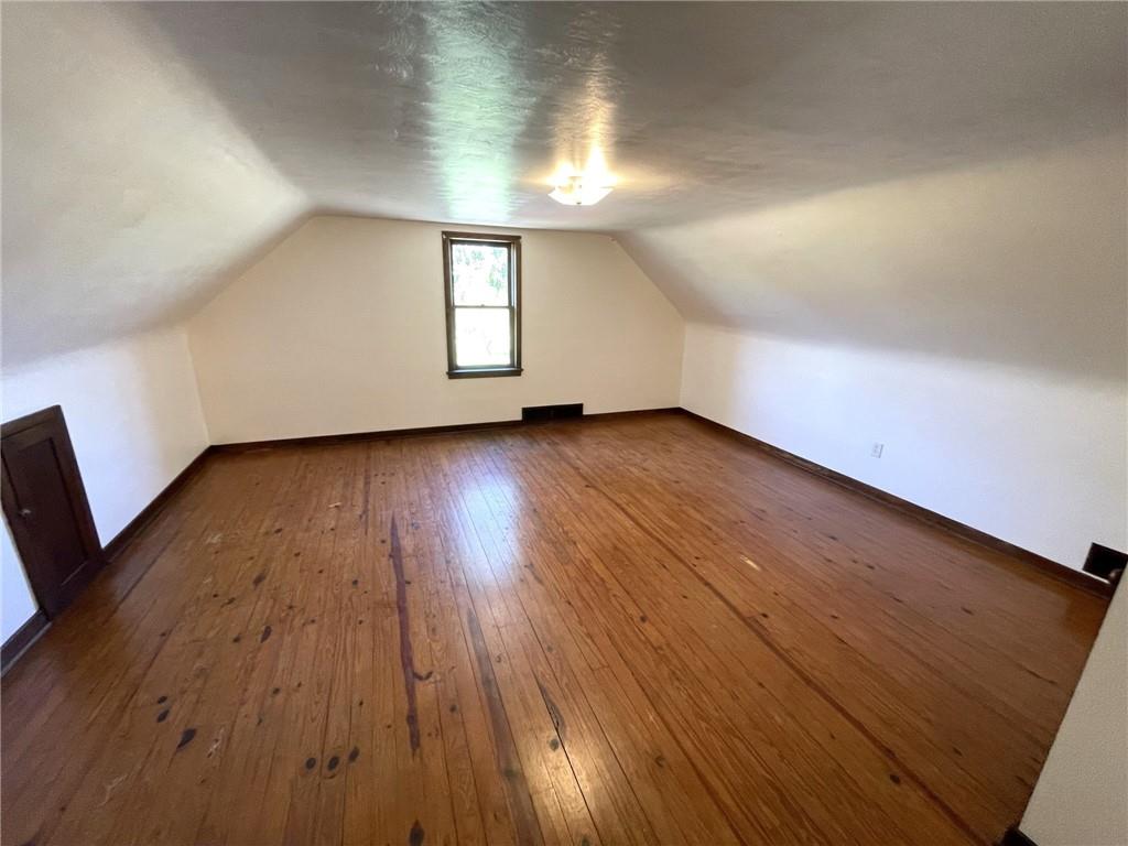 436 East Slippery Rock Road Chicora, PA 16025 - Photo 15 of 40 an empty room with wooden floor and windows
