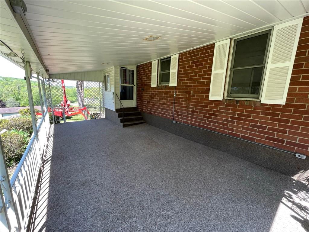 436 East Slippery Rock Road Chicora, PA 16025 - Photo 25 of 40 a view of a porch with furniture and floor to ceiling window