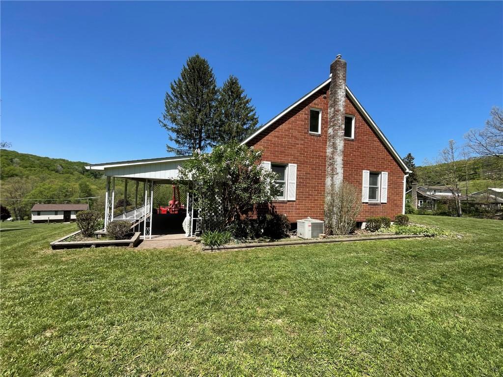 436 East Slippery Rock Road Chicora, PA 16025 - Photo 28 of 40 a view of a house with a yard and sitting area