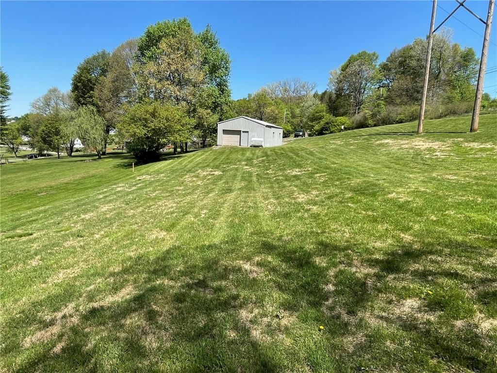 436 East Slippery Rock Road Chicora, PA 16025 - Photo 37 of 40 a view of a field with grass and trees