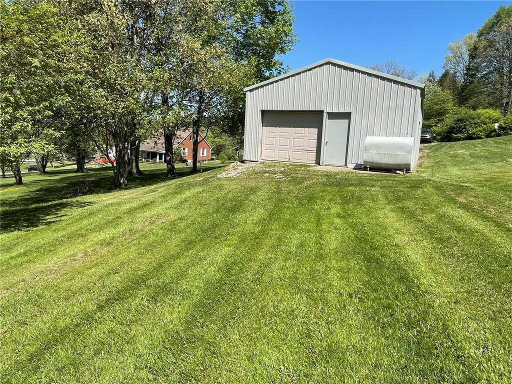 436 East Slippery Rock Road Chicora, PA 16025 - Photo 38 of 40 a front view of a house with a yard and trees