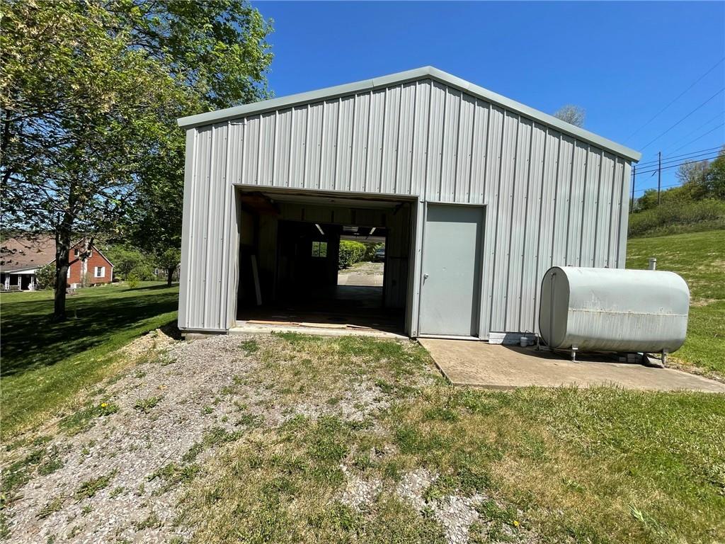 436 East Slippery Rock Road Chicora, PA 16025 - Photo 39 of 40 a front view of a house with garden