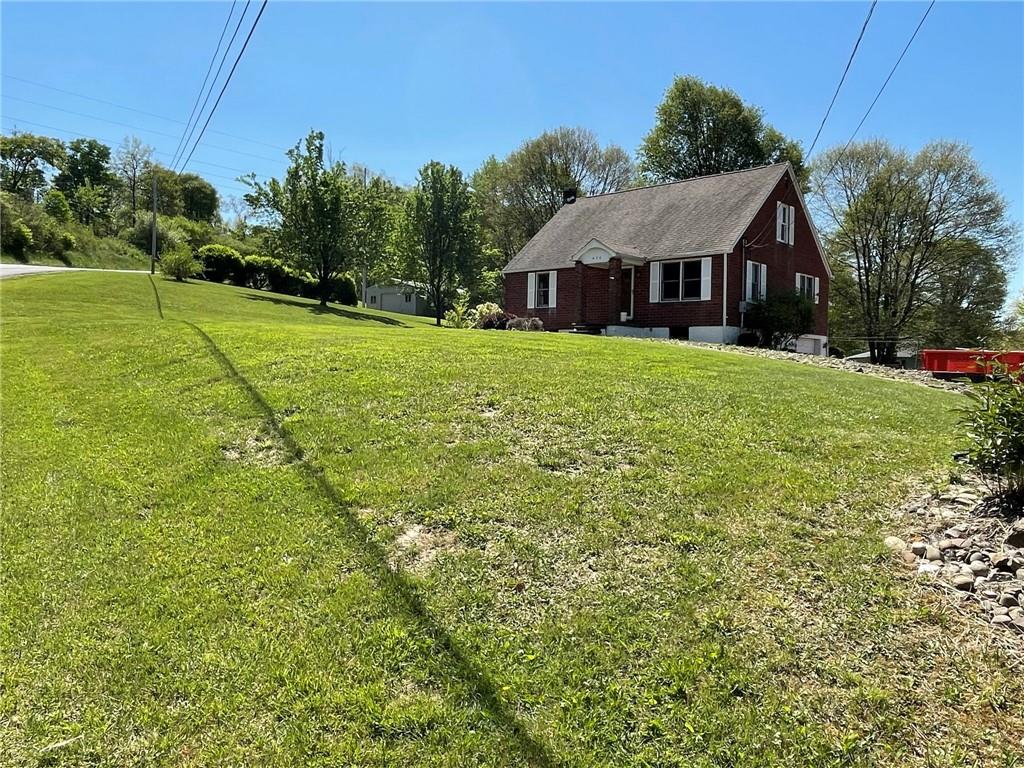 436 East Slippery Rock Road Chicora, PA 16025 - Photo 5 of 40 a front view of a house with yard and green space