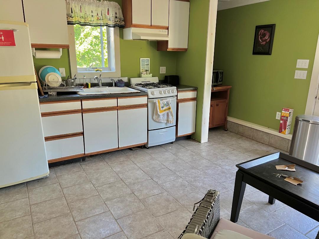 2 Farmers Road Edgartown, MA 02539 - Photo 14 of 27 a view of a kitchen with fridge and workspace