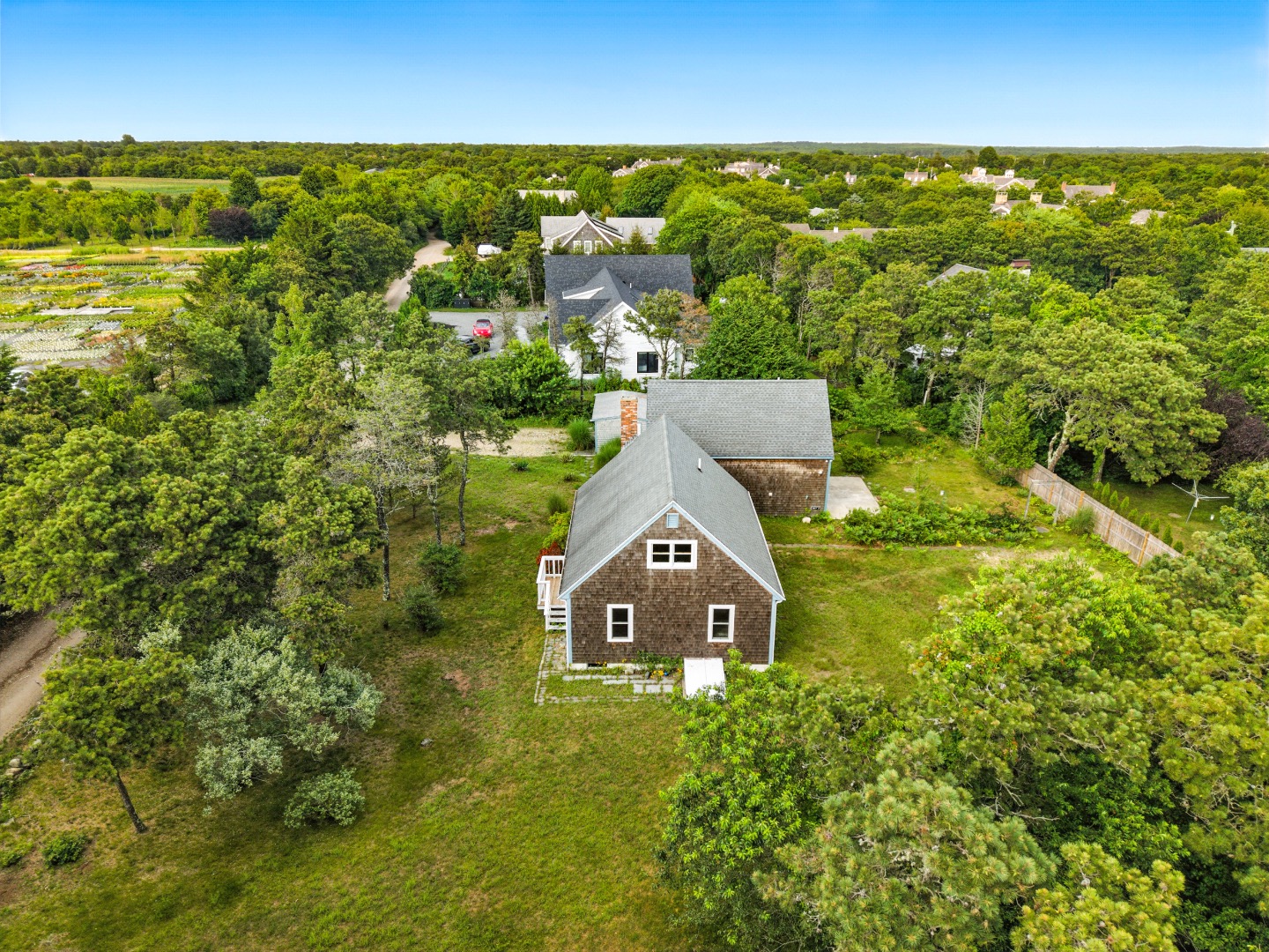 2 Farmers Road Edgartown, MA 02539 - Photo 3 of 27 an aerial view of residential houses with outdoor space and trees