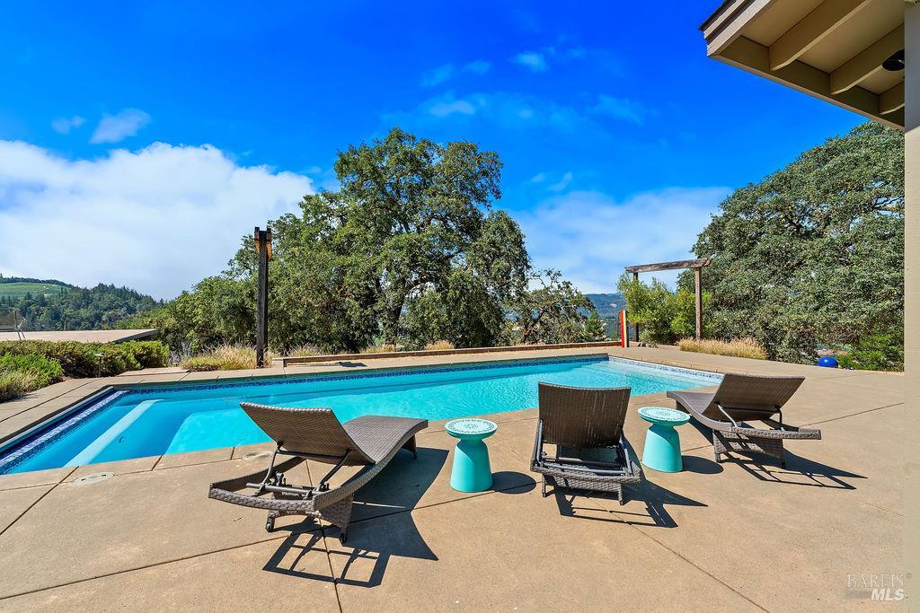 Private hilltop retreat perched above Alexander Valley on 11+ scenic acres.