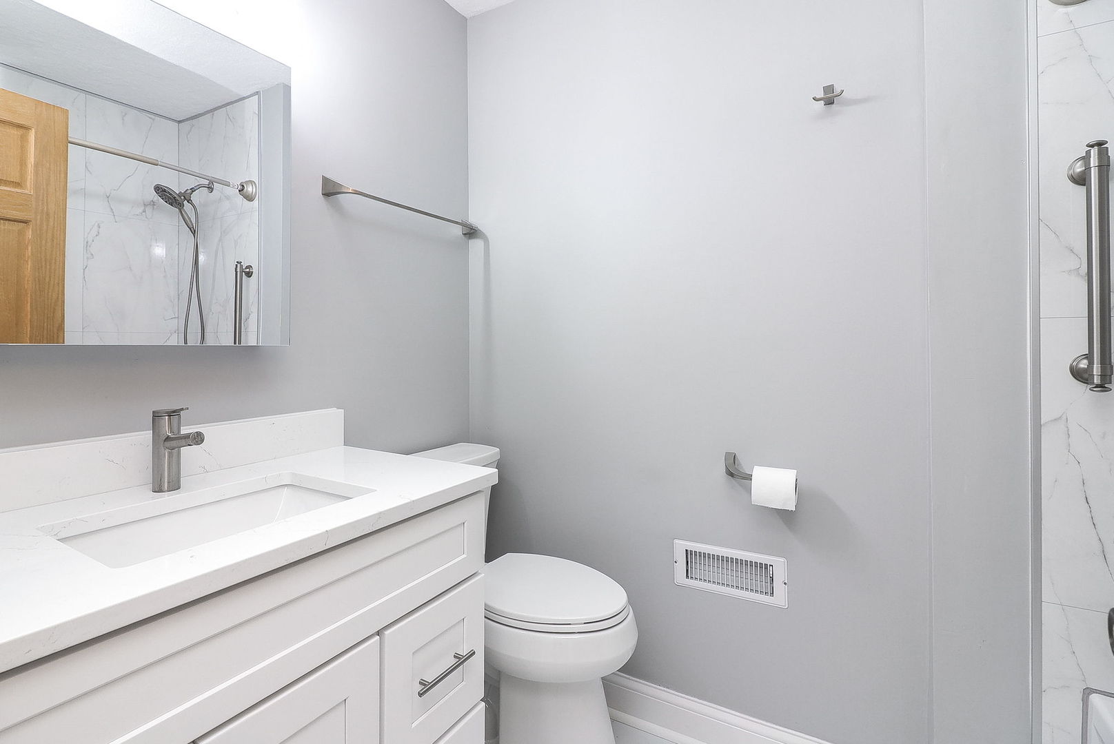 1482 Timber Trail, Unit B Wheaton, IL 60189 - Photo 11 of 20 a bathroom with a sink toilet and a mirror