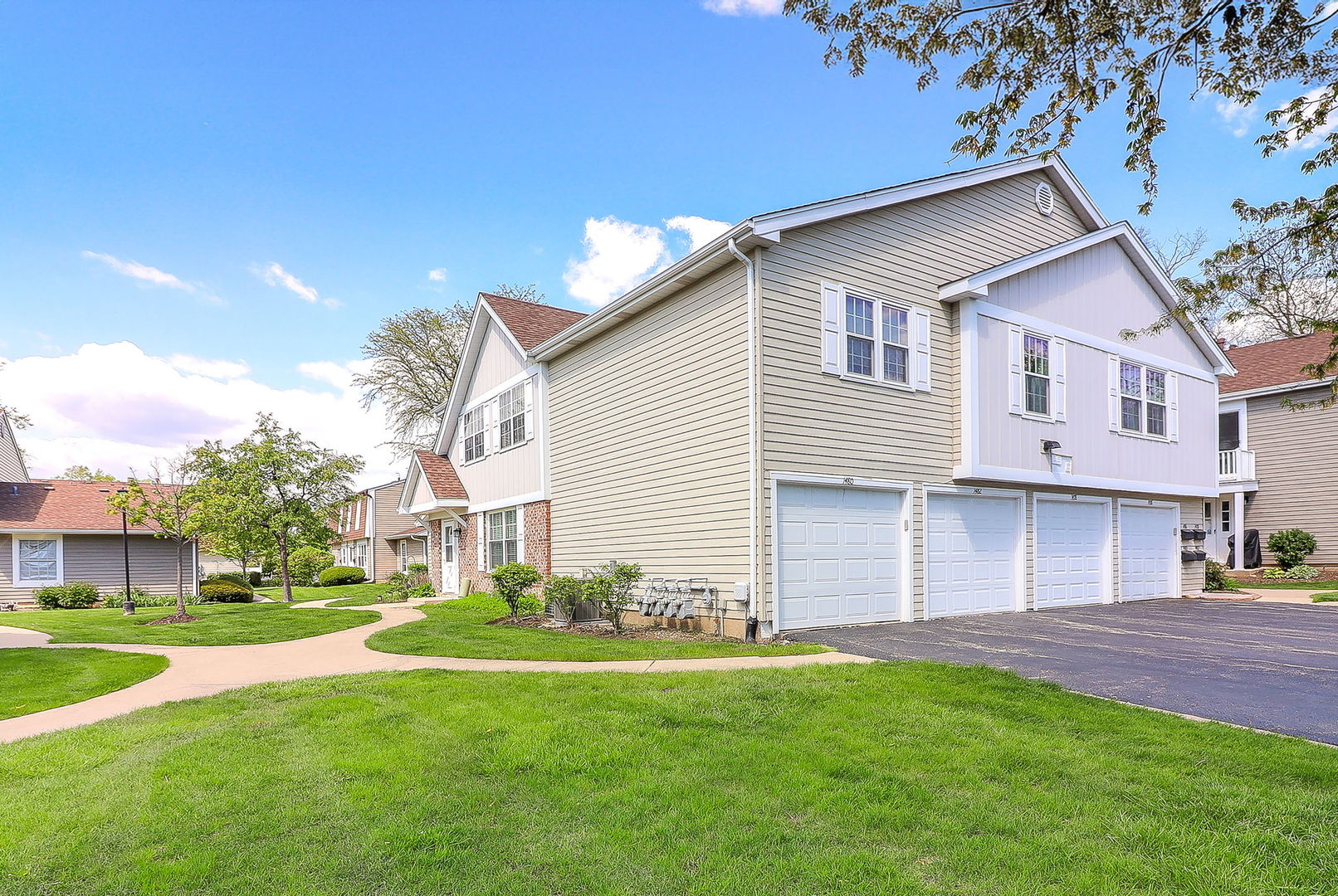 1482 Timber Trail, Unit B Wheaton, IL 60189 - Photo 14 of 20 a front view of a house with a garden