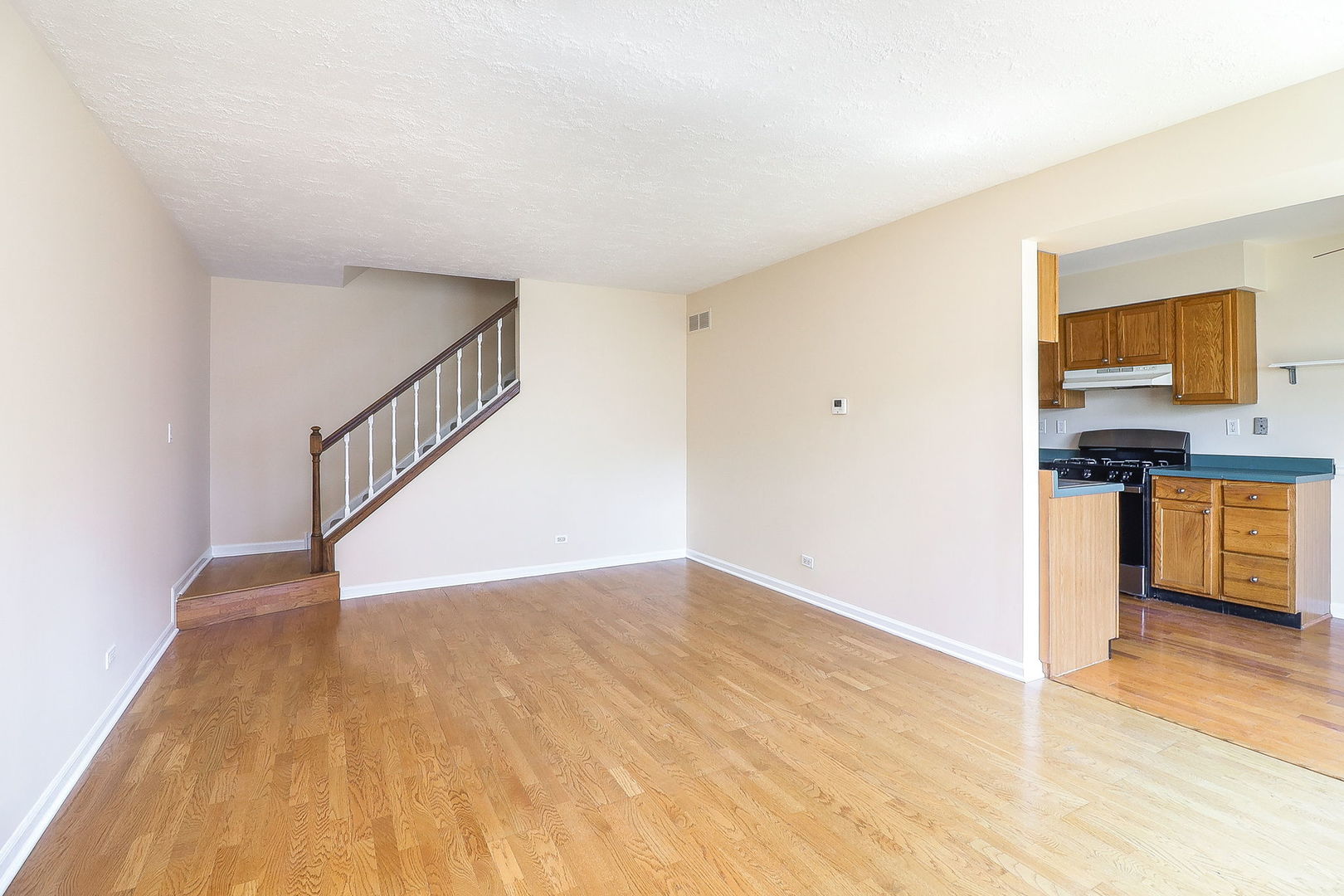 1482 Timber Trail, Unit B Wheaton, IL 60189 - Photo 4 of 20 a view of kitchen with wooden floor and electronic appliances