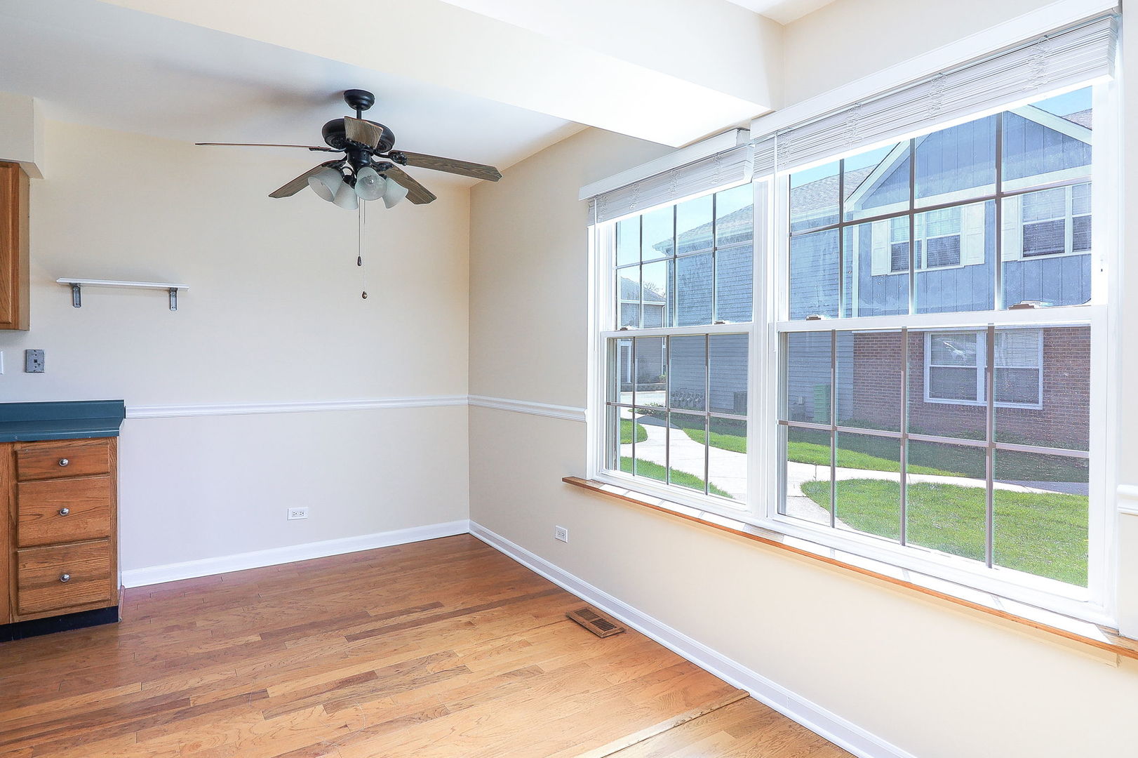 1482 Timber Trail, Unit B Wheaton, IL 60189 - Photo 8 of 20 a view of an empty room with a window