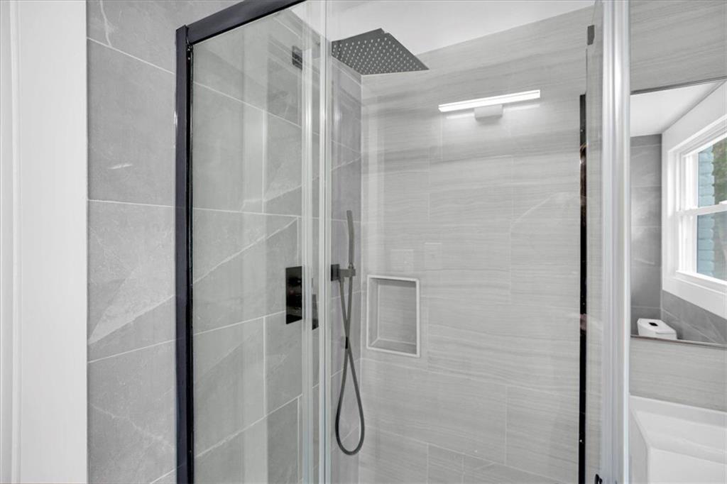 2271 Cresta Drive Decatur, GA 30032 - Photo 17 of 47 a bathroom with a glass shower door