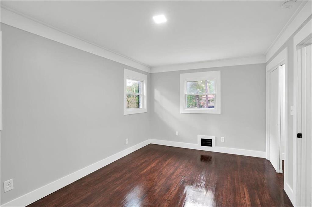 2271 Cresta Drive Decatur, GA 30032 - Photo 19 of 47 an empty room with wooden floor and windows