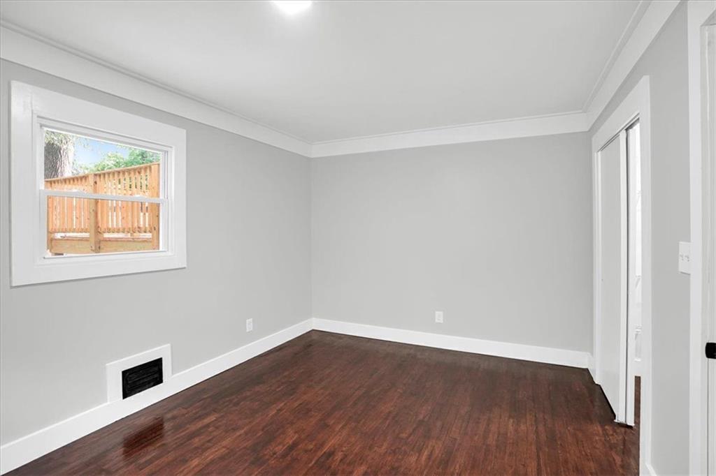 2271 Cresta Drive Decatur, GA 30032 - Photo 22 of 47 wooden floor in an empty room with a window