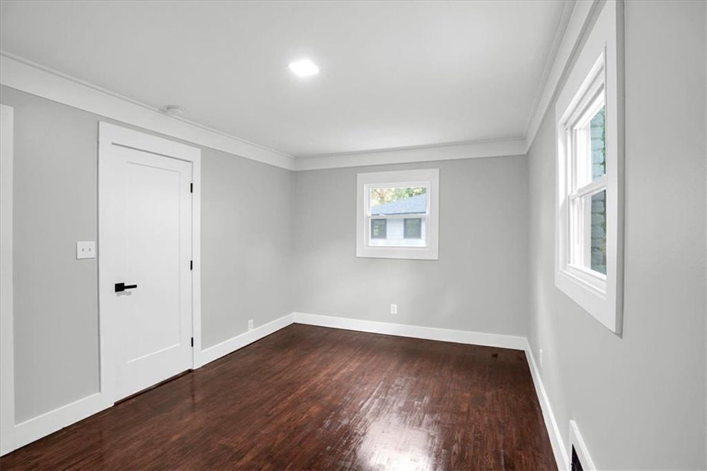 2271 Cresta Drive Decatur, GA 30032 - Photo 25 of 47 an empty room with wooden floor and windows