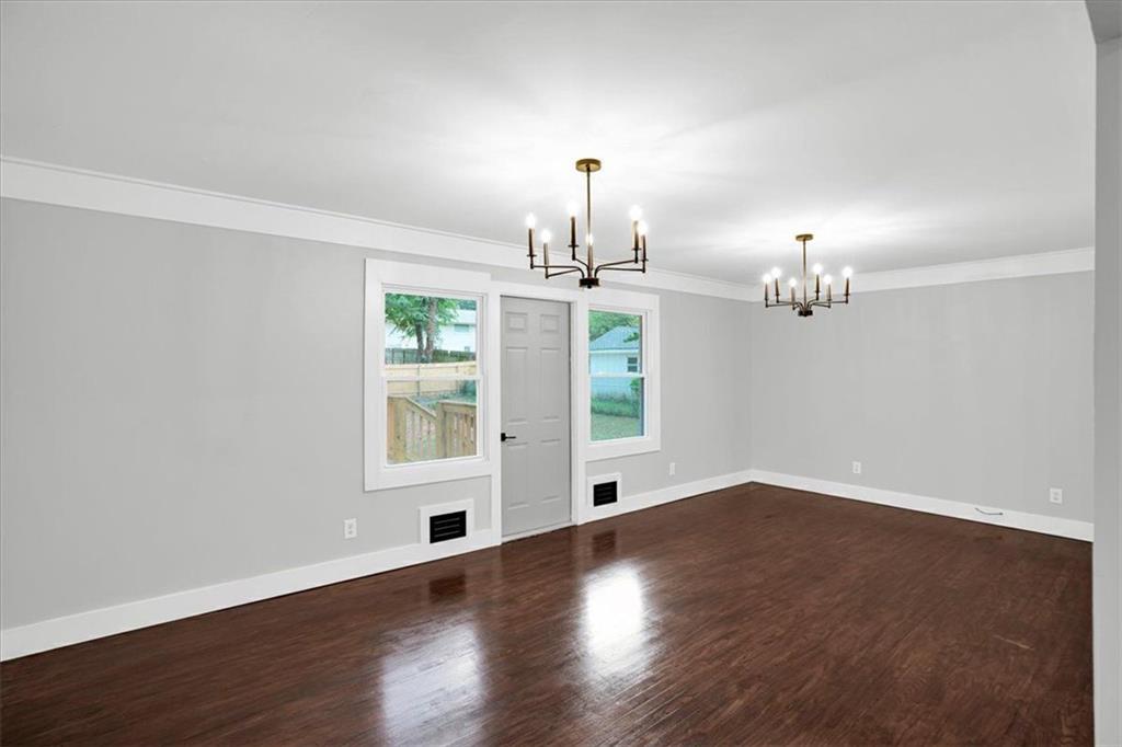 2271 Cresta Drive Decatur, GA 30032 - Photo 4 of 47 a view of an empty room with wooden floor and a window