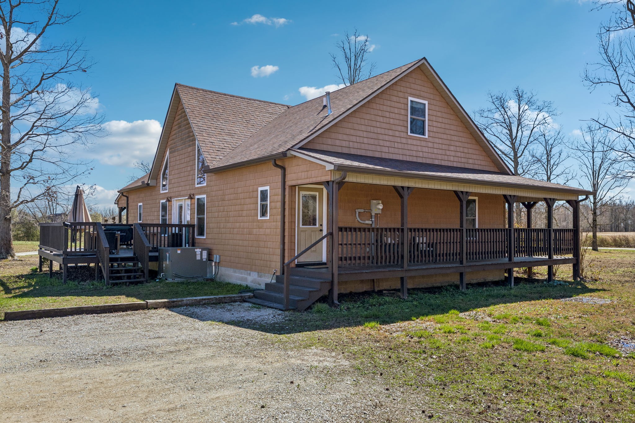 267 Switzerland Road Hohenwald, TN 38462 - Photo 8 of 98 a front view of a house with a yard