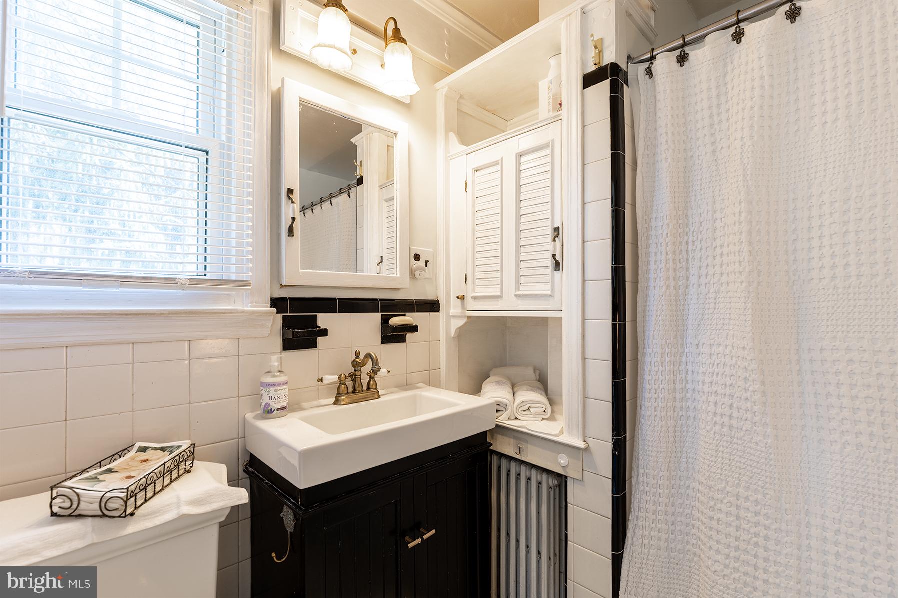 1438 Ridgeway East Arnold, MD 21012 - Photo 15 of 50 a bathroom with a sink and a mirror