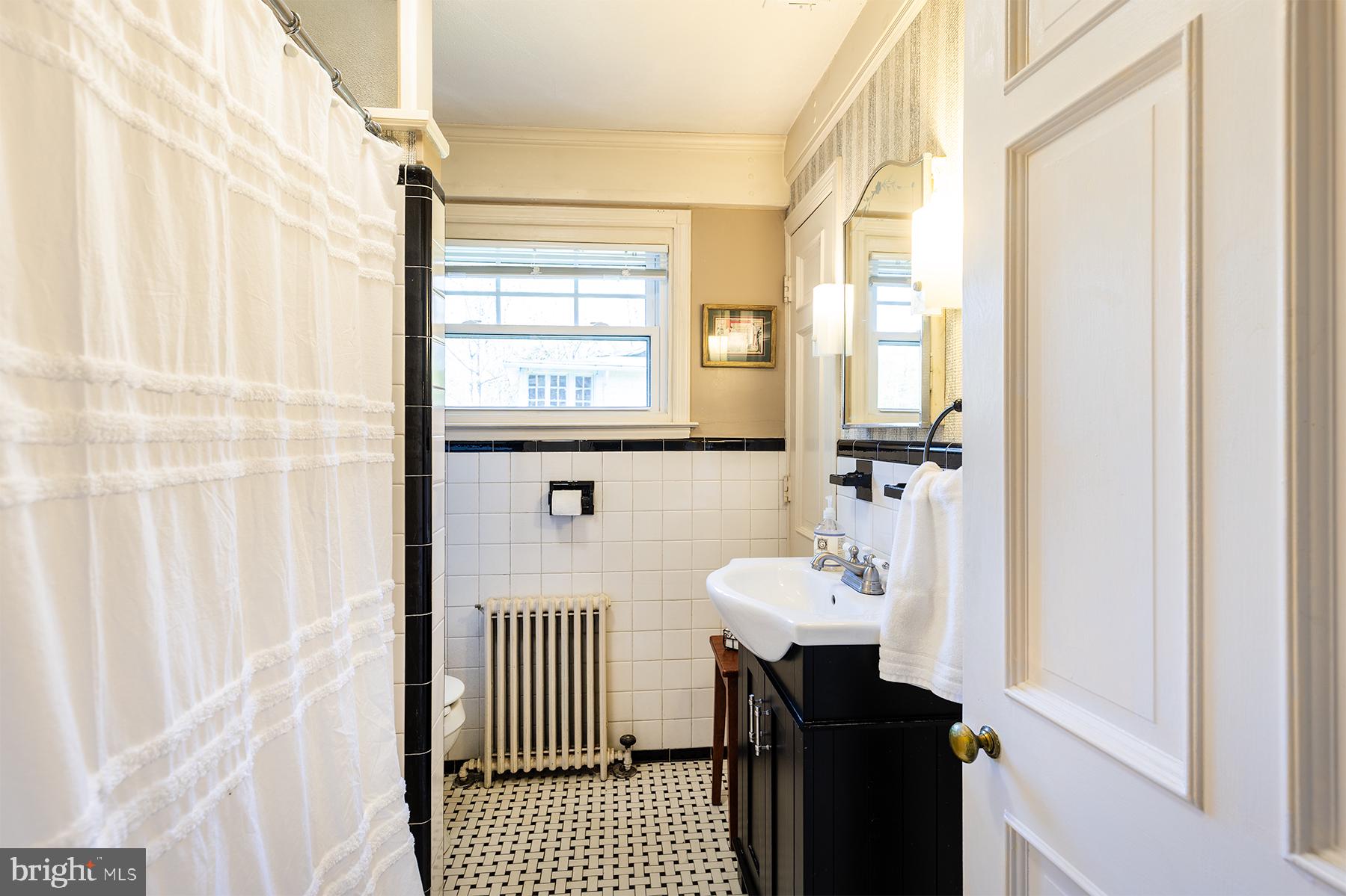1438 Ridgeway East Arnold, MD 21012 - Photo 22 of 50 a bathroom with a sink a mirror and a shower