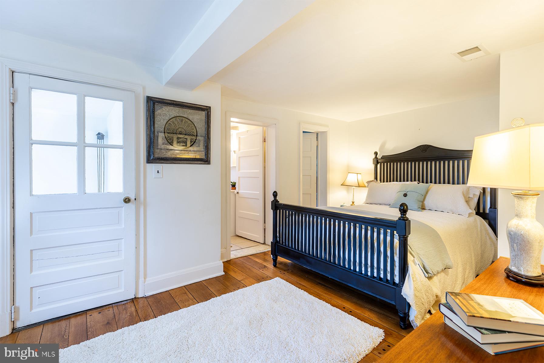 1438 Ridgeway East Arnold, MD 21012 - Photo 28 of 50 a bedroom with a bed and wooden floor