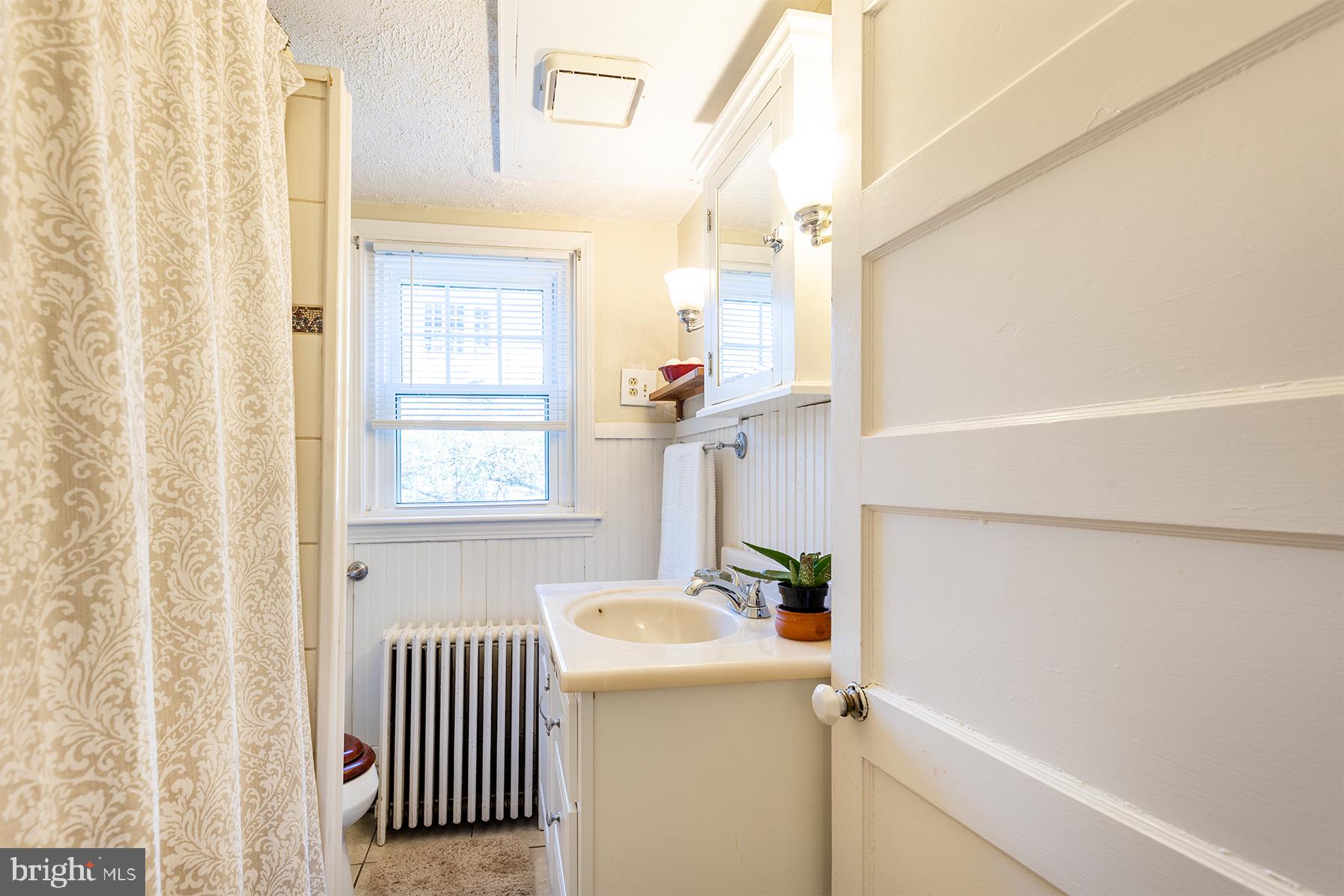 1438 Ridgeway East Arnold, MD 21012 - Photo 31 of 50 a bathroom with a sink and a window