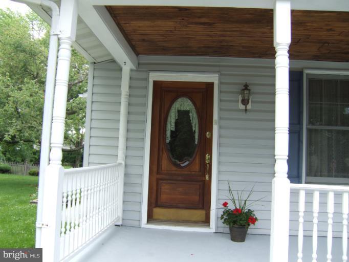2 Hampton Road Linthicum Heights, MD 21090 - Photo 1 of 25 a front view of a house with a garage