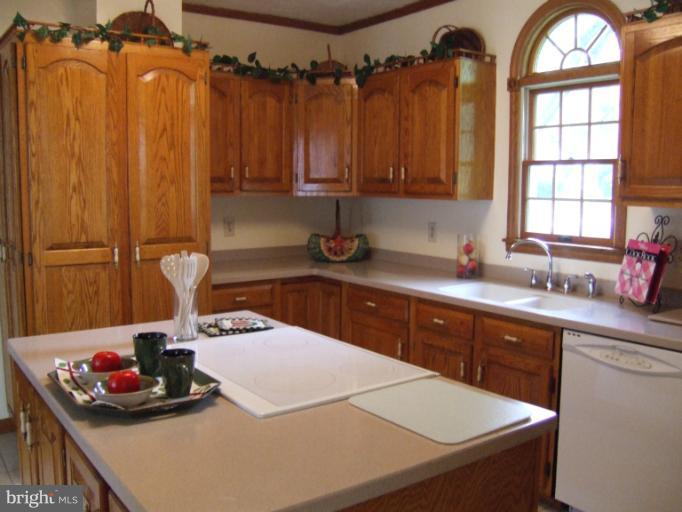 2 Hampton Road Linthicum Heights, MD 21090 - Photo 3 of 25 a kitchen with a sink cabinets and window