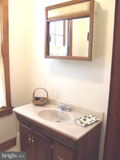 2 Hampton Road Linthicum Heights, MD 21090 - Photo 4 of 25 a bathroom with a sink and a window