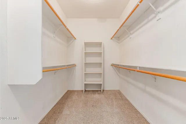 a view of an empty walk in closet