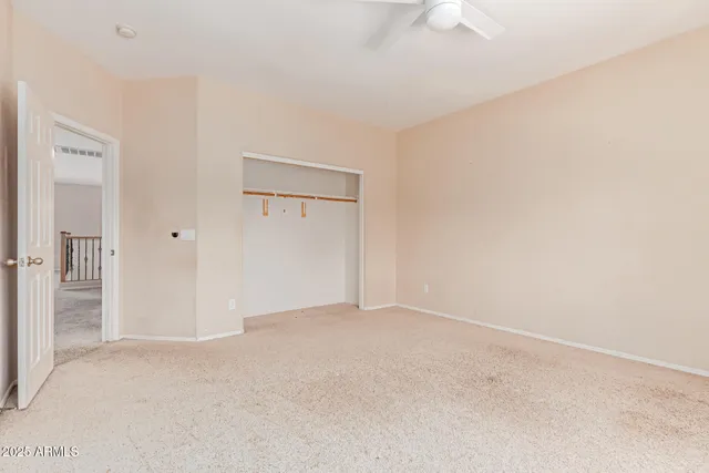 an empty room with a empty space and windows