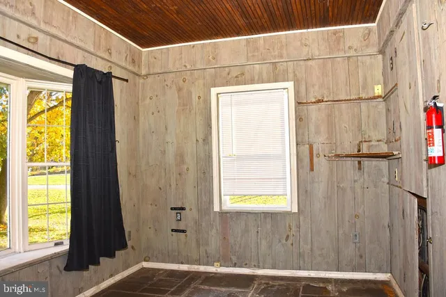 a bathroom with a window and a shower