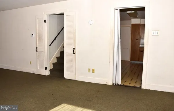 a bathroom with a sink a mirror and a shower