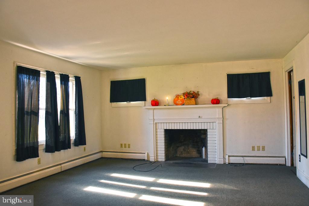 121 Country Club Lane Mill Hall, PA 17751 - Photo 7 of 31 a view of a livingroom with an empty space and a fireplace