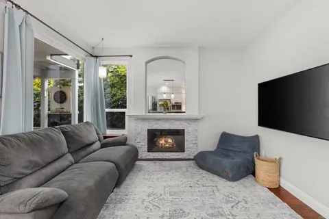 a kitchen with stainless steel appliances granite countertop a sink refrigerator and microwave