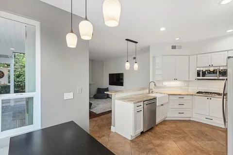 a view of storage and utility room with washer and dryer