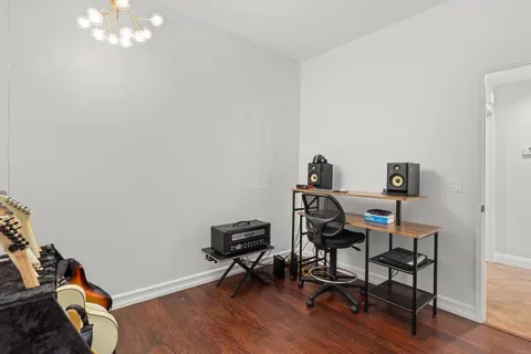 a bedroom with a bed and a fireplace