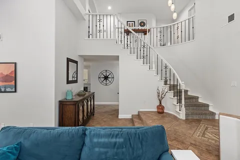 a bedroom with a bed and a desk