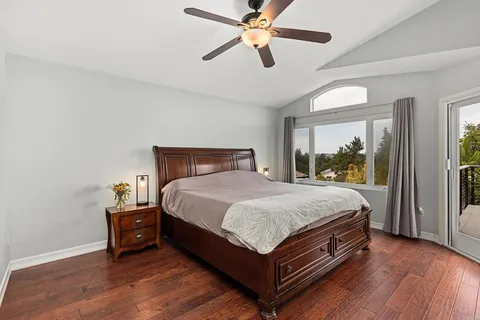 a bathroom with a granite countertop sink a large mirror and a shower