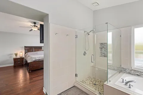 a view of an outdoor sitting area with furniture and a backyard