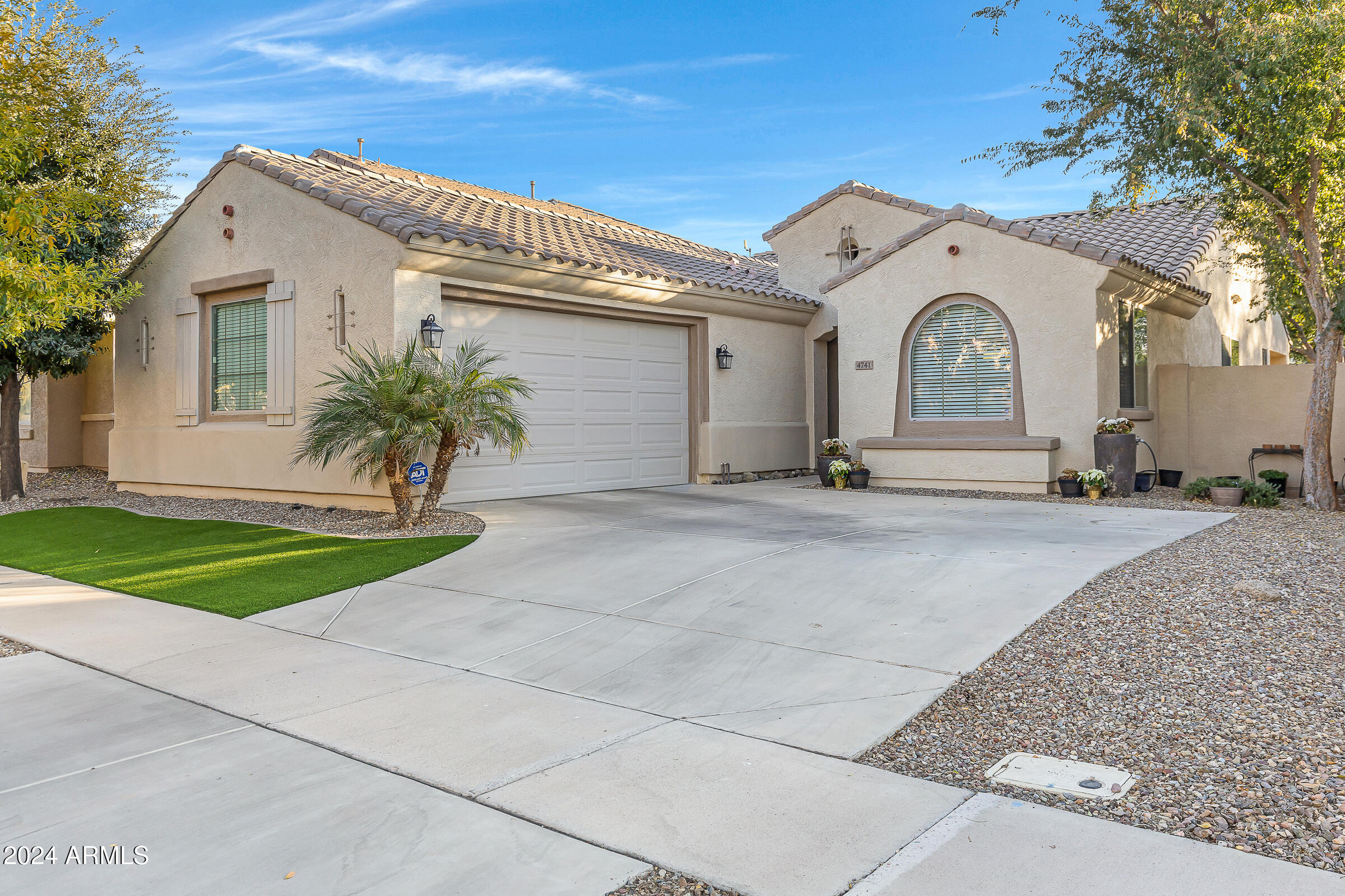 4741 East Timberline Road Gilbert, AZ 85297 - Photo 1 of 44 a view of a white house with a outdoor space