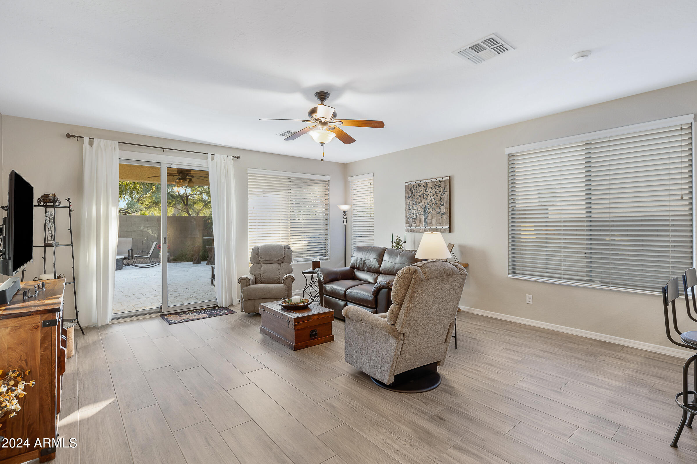 4741 East Timberline Road Gilbert, AZ 85297 - Photo 13 of 44 a living room with furniture and a flat screen tv