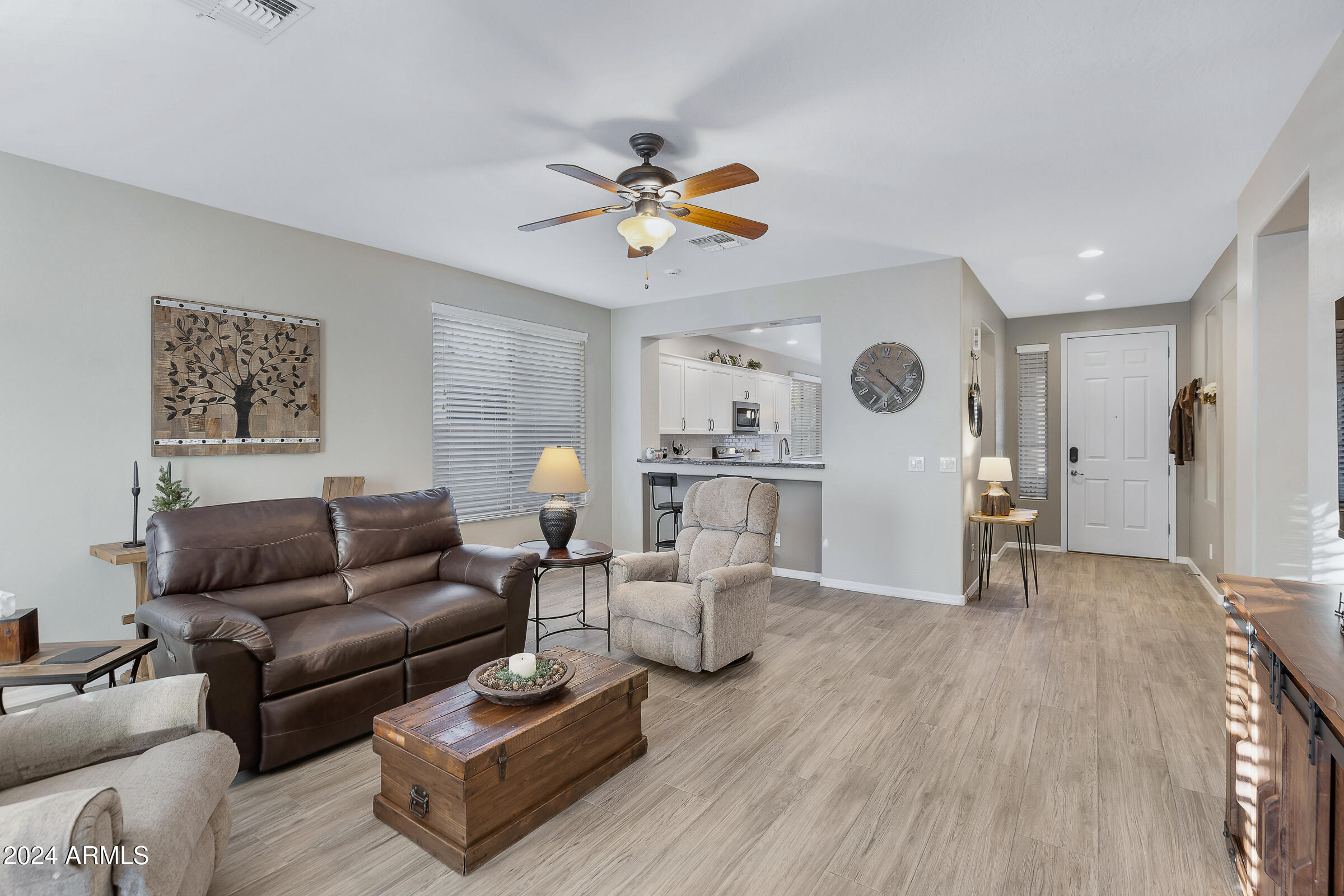4741 East Timberline Road Gilbert, AZ 85297 - Photo 14 of 44 a living room with furniture and a wooden floor