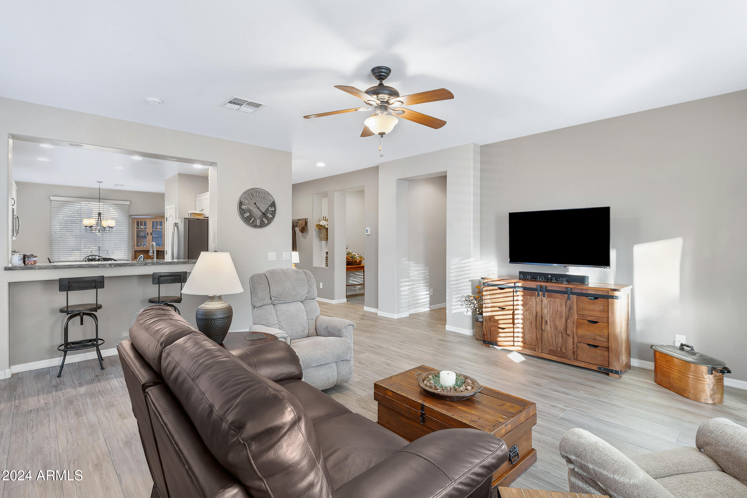 4741 East Timberline Road Gilbert, AZ 85297 - Photo 15 of 44 a living room with furniture and a flat screen tv