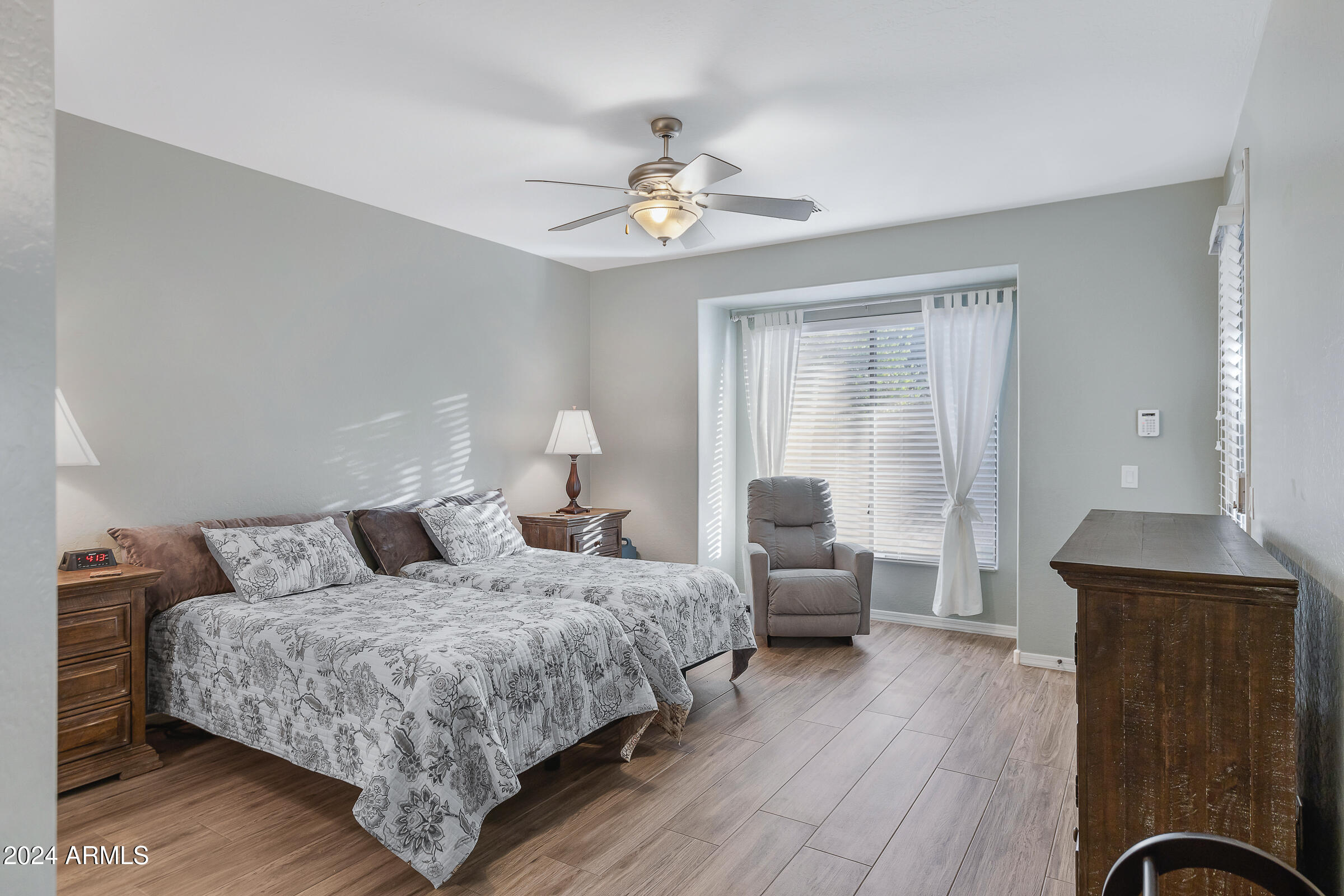 4741 East Timberline Road Gilbert, AZ 85297 - Photo 16 of 44 a bedroom with bed and a dresser